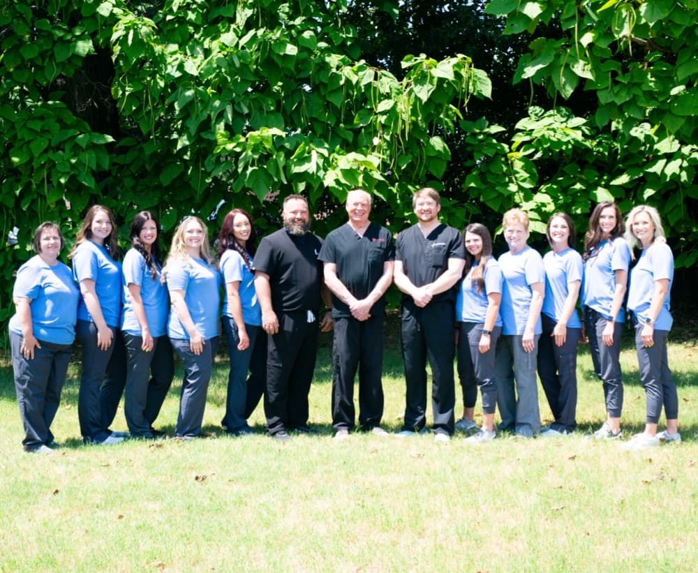 northeast arkansas team smiling